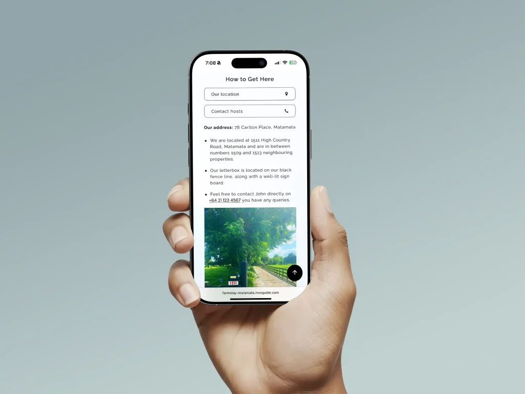InvoGuide: Digital guidebooks for Airbnbs or vacation rental properties a hand holding a cell phone displaying an InvoGuide, a digital guidebook.